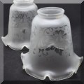 D17. 2 Vintage glass shades with floral design and scalloped edges. - $12 for the pair 